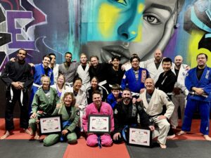Group of Brazilian Jiu-Jitsu students and coaches on the mats at Straight Blast Gym Calgary, showing a friendly beginner-friendly Jiu Jitsu gym in Calgary.