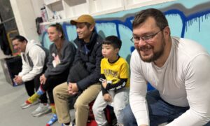 Parents watching their child train Brazilian Jiu-Jitsu at Straight Blast Gym Calgary, supporting learning and confidence on the mats.
