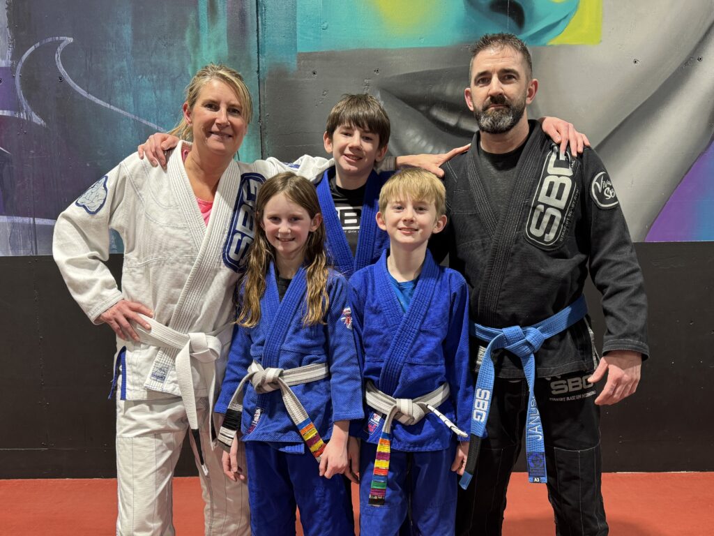 Parents and kids training jiu-jitsu at SBG Calgary
