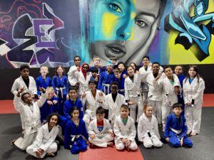 Smiling group of kids after Brazilian Jiu-Jitsu class in Calgary