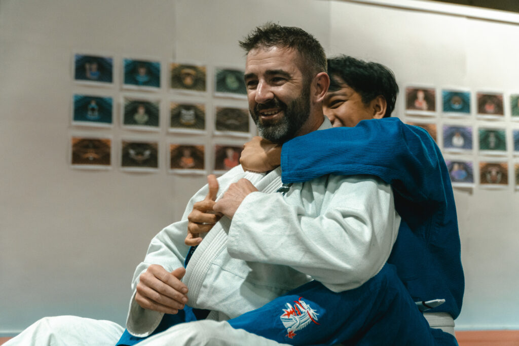 Beginner Brazilian jiu-jitsu class drilling safely at SBG Calgary