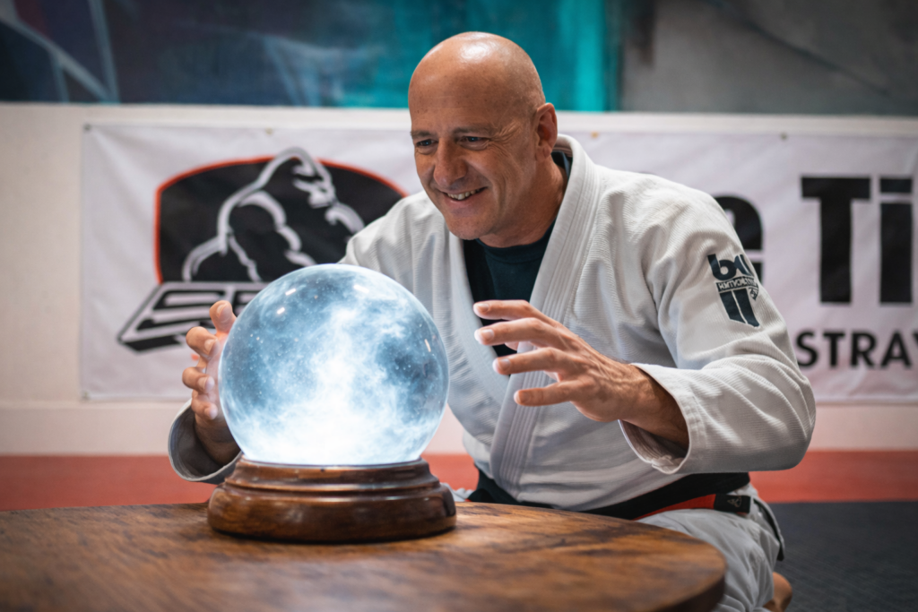 Coach Mike looking into a crystal ball in a Brazilian jiu-jitsu gi at Straight Blast Gym Calgary
